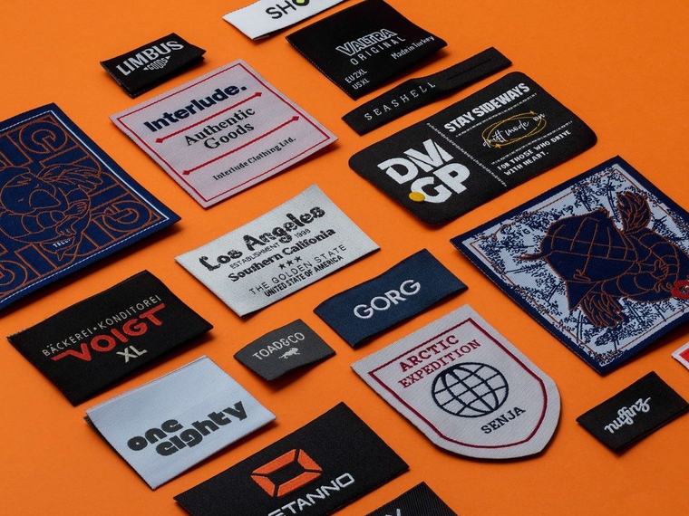 Collection of custom woven clothing labels, size tabs and brand tags